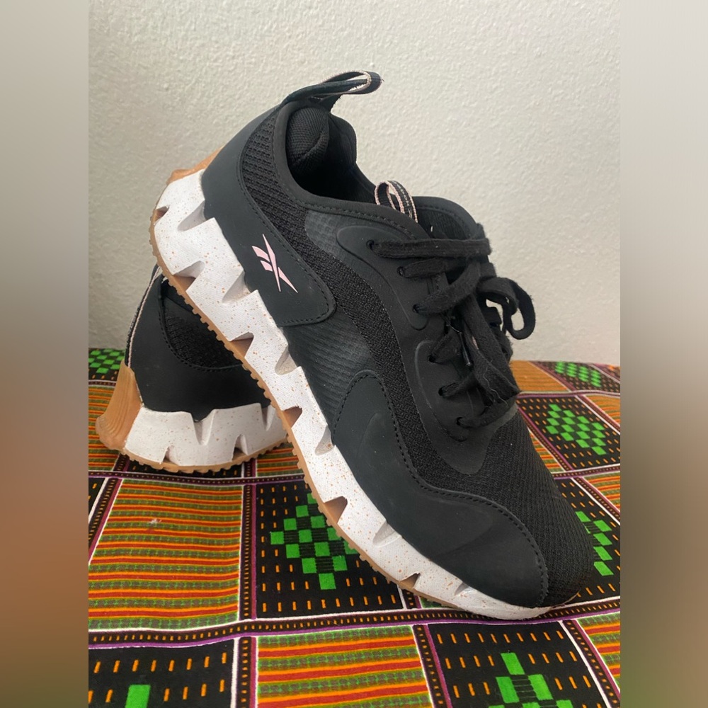 Black women’s Reebok sneakers.